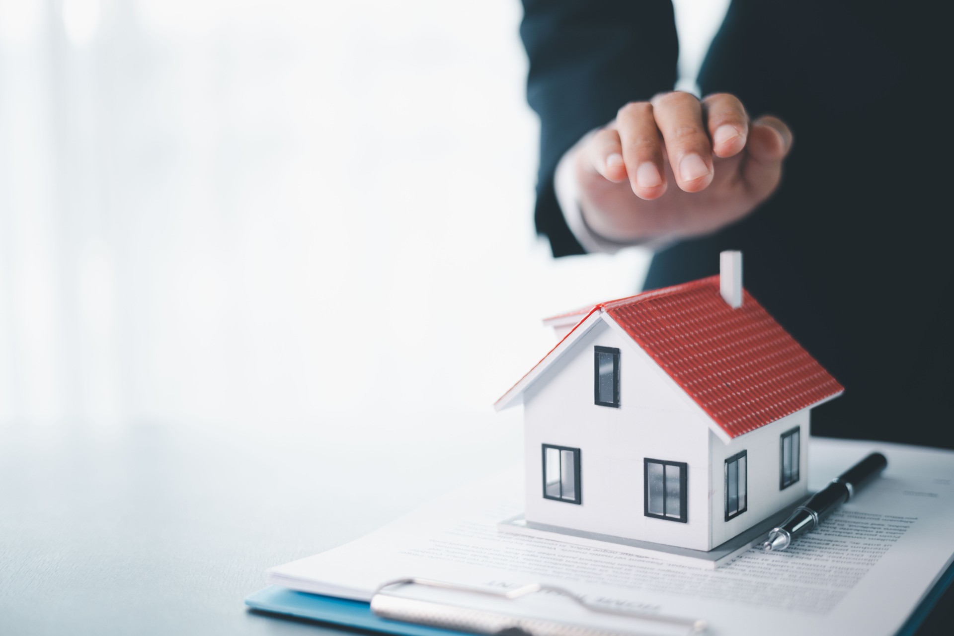 Concept business house finance protection office plan investment buy sell home ensuring idea financial security. residence agent hand protect purchase insurance and secure favorable loan deal.